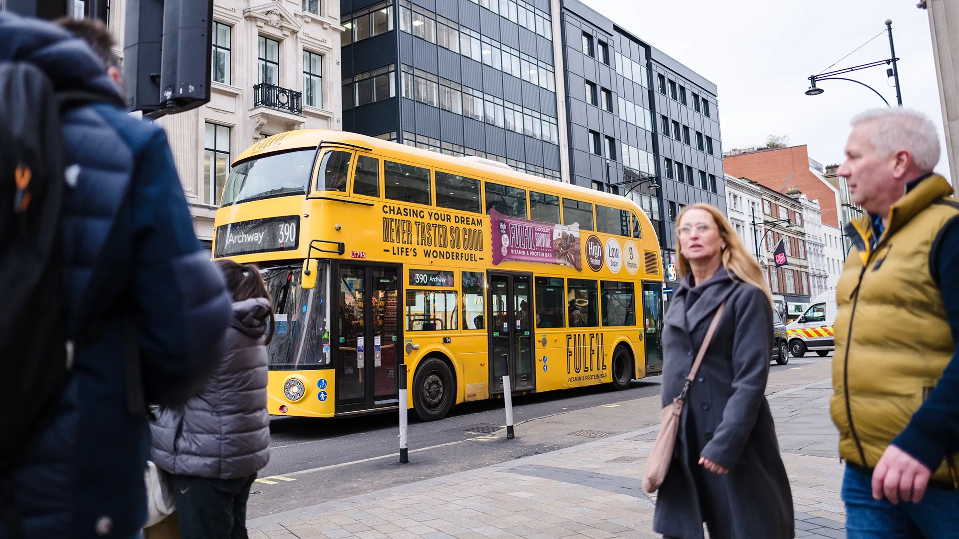 A London Routemaster bus wrapped in yellow branding for Fulfil high protein bars