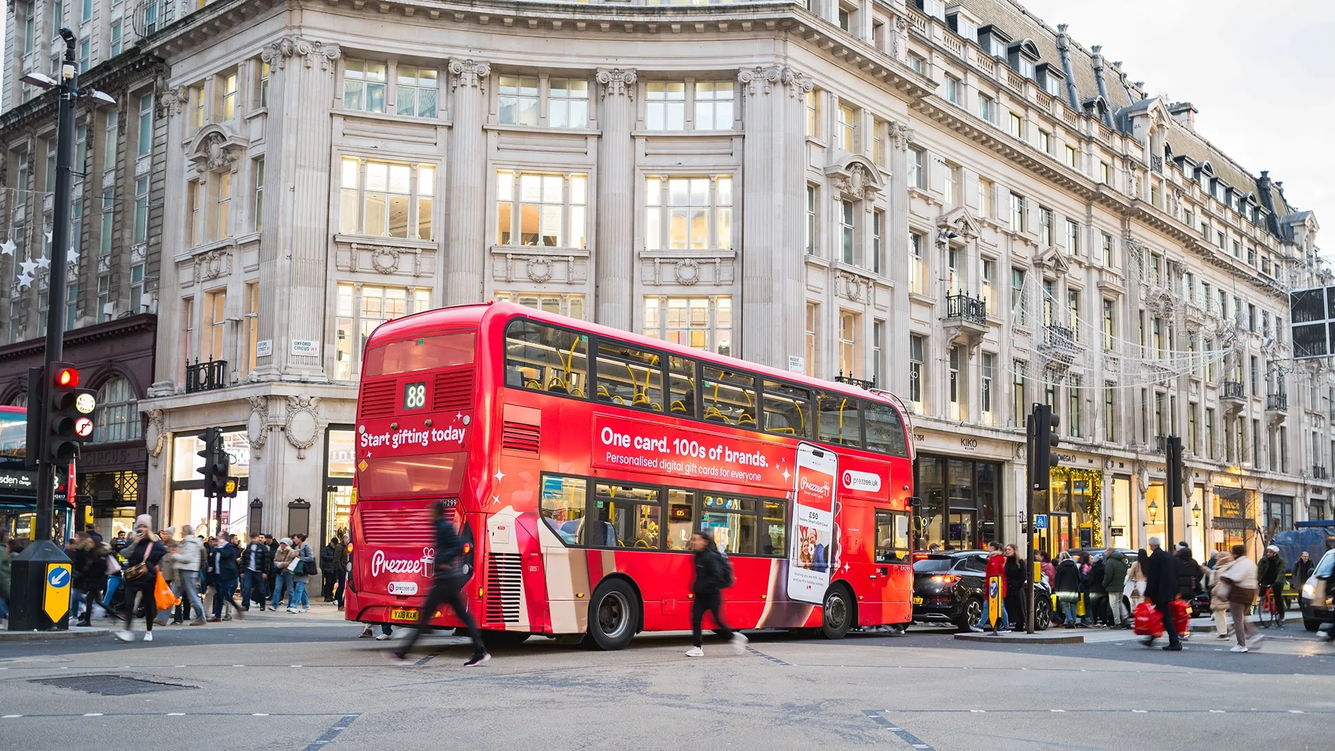 Prezzee-wrapped London bus delivering Christmas cheer along Oxford Street